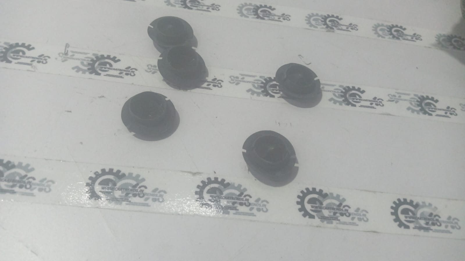 General Motors Astra water drain plug, automotive part designed for water drainage in vehicle engine compartments.