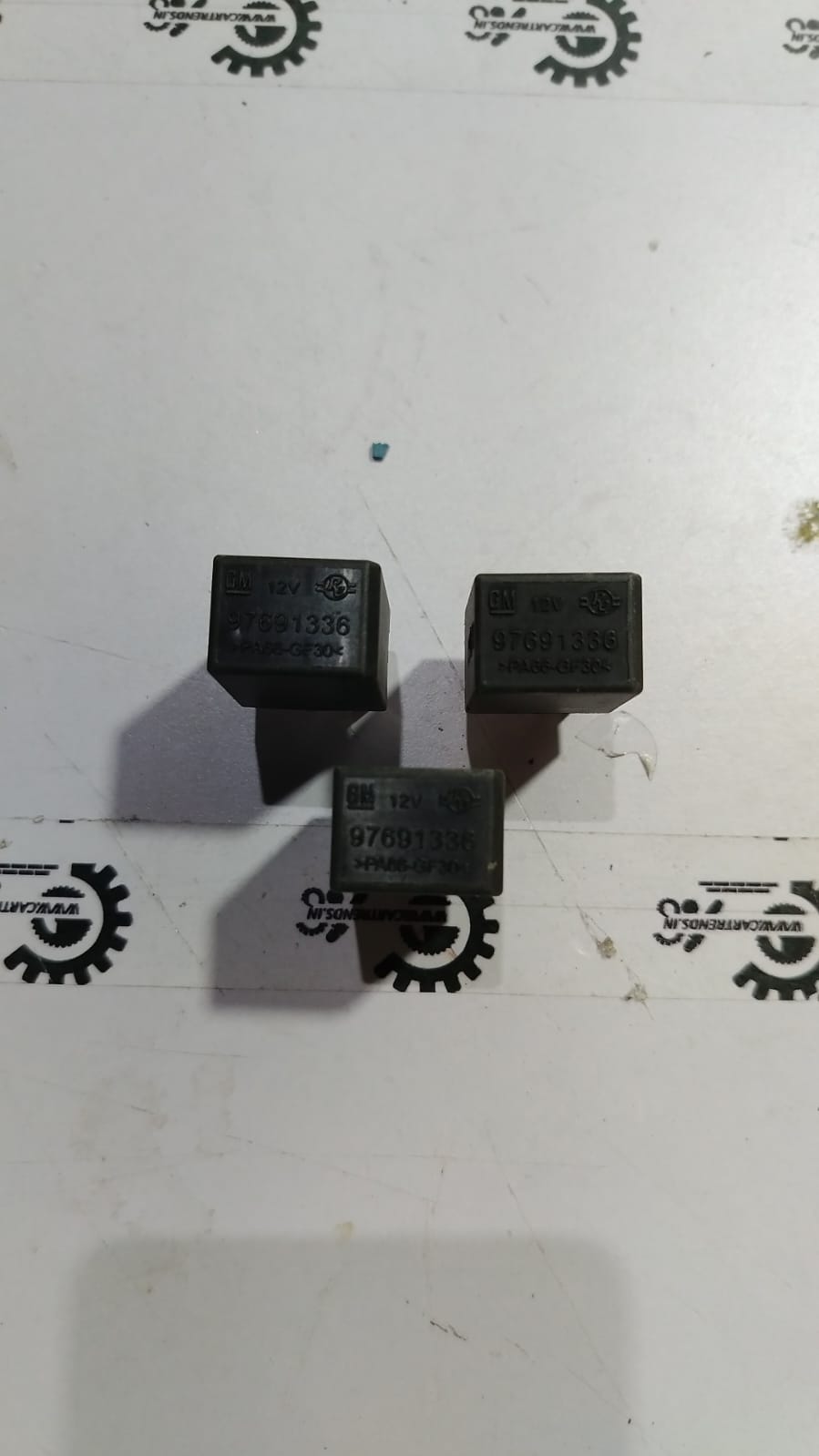 General Motors Tavera relay T97691336, automotive part for Tavera vehicle, showing the relay component with labels and connectors.