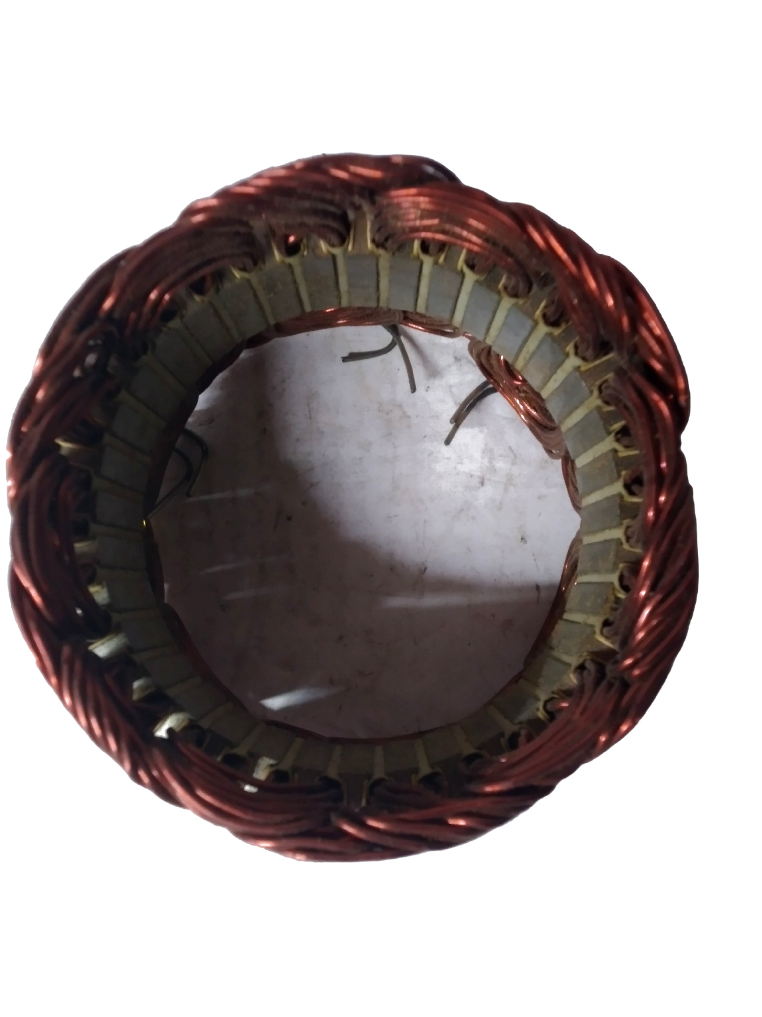 Chevrolet Spark engine Stator by General Motors, close-up view of the circular electrical component for vehicle performance.