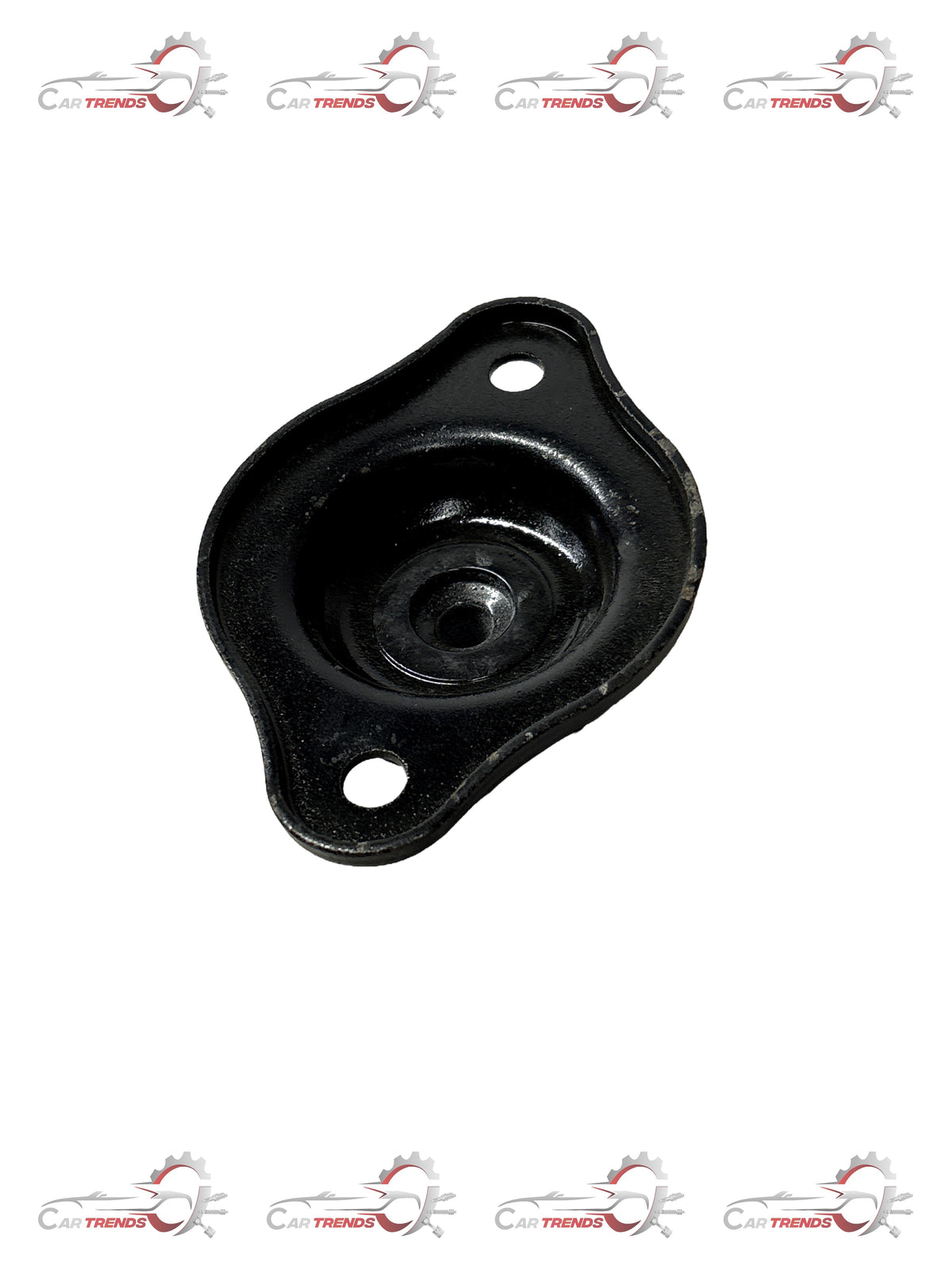 General Motors strut mount for Aveo, model J981094L0, showing the black metal component with mounting points and rubber insulator.