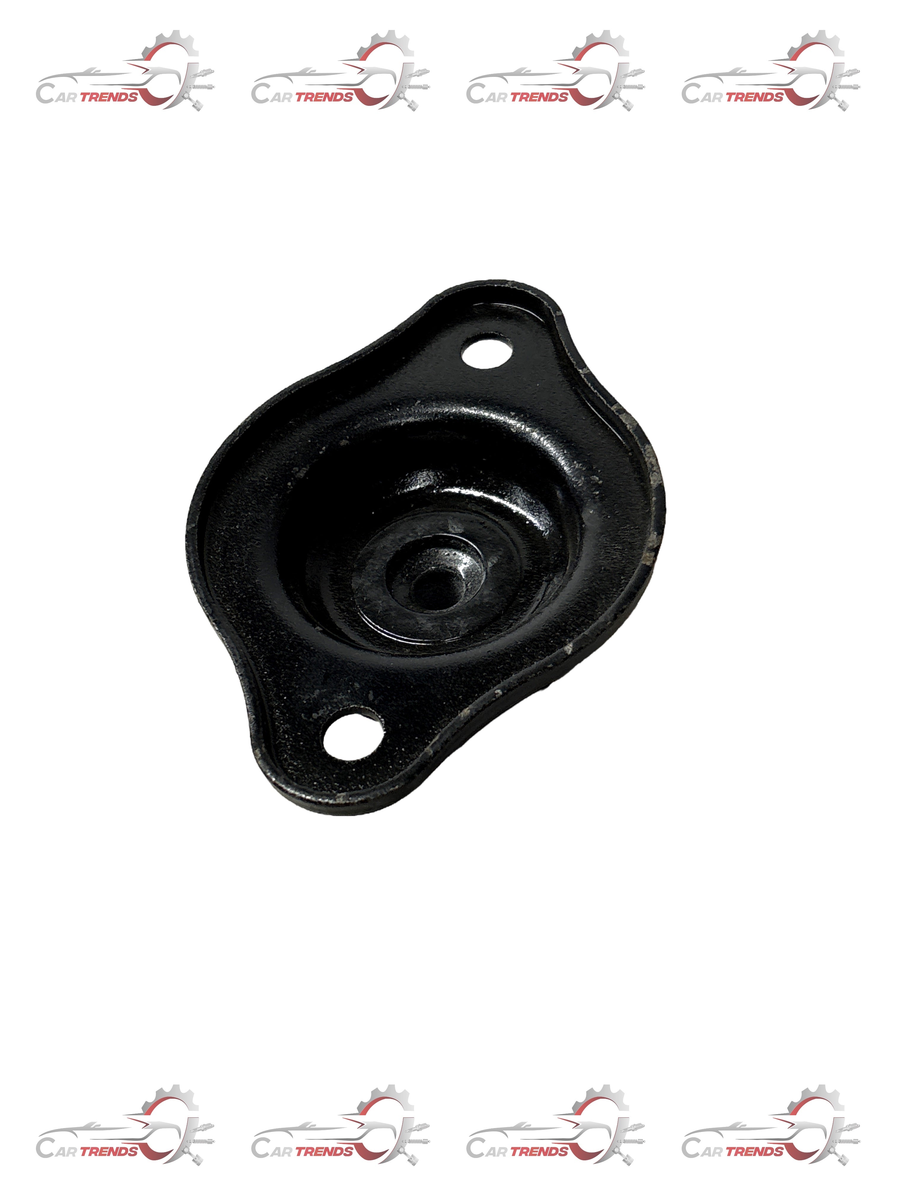 General Motors strut mount for Aveo, model J981094L0, showing the black metal component with mounting points and rubber insulator.