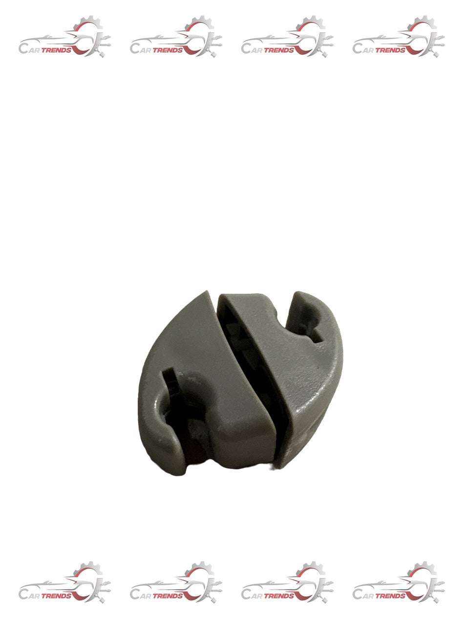 General Motors Spark sunvisor holder, black plastic accessory for securing sun visors in vehicle interior.
