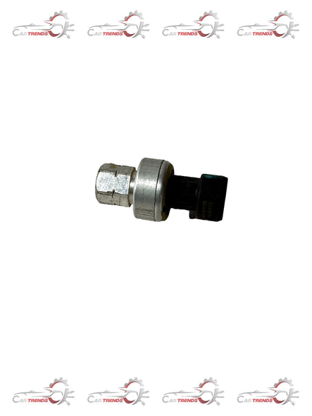 General Motors Optra petrol pressure transducer switch, automotive sensor part with electrical connection and pressure sensing components.