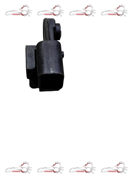 Two-way connector for Tavera from General Motors, showing the black plastic component with metal contacts and wiring connections.