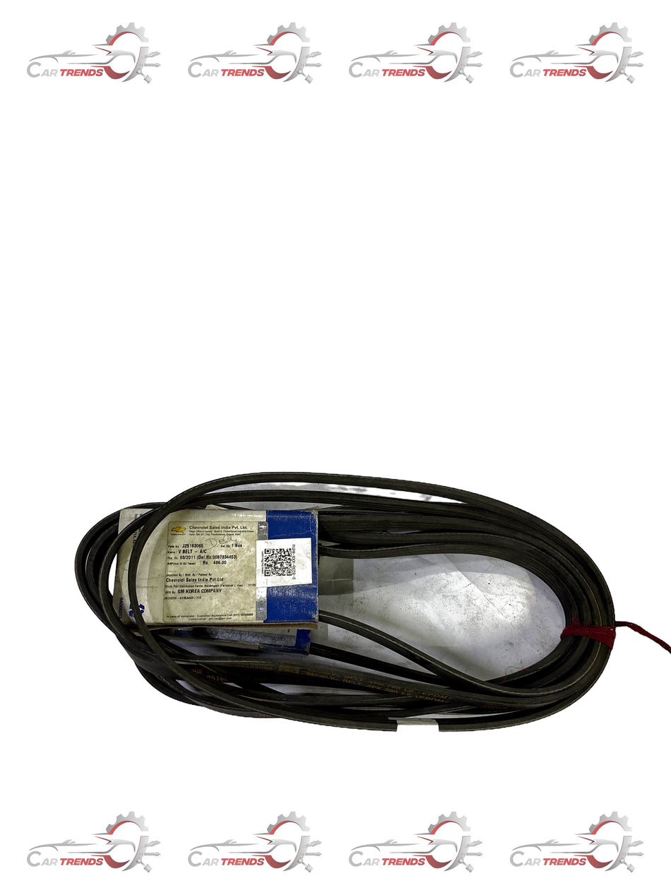 General Motors V-belt A/C Spark J25183065 for automotive engine, showing the belt's rubber and pulley alignment.