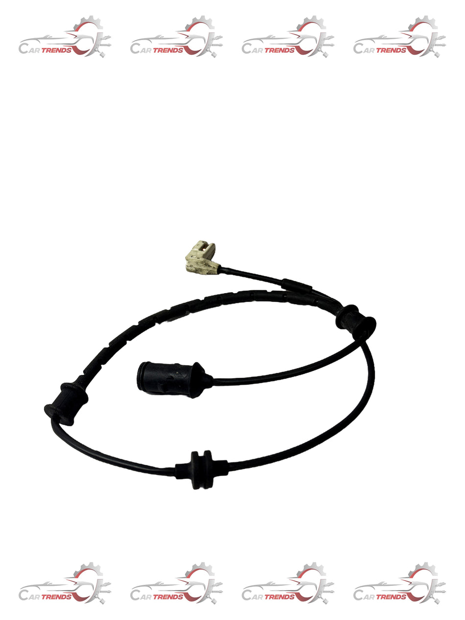 General Motors brake sensor spare part, showing the sensor component with wiring and connectors for vehicle braking system.