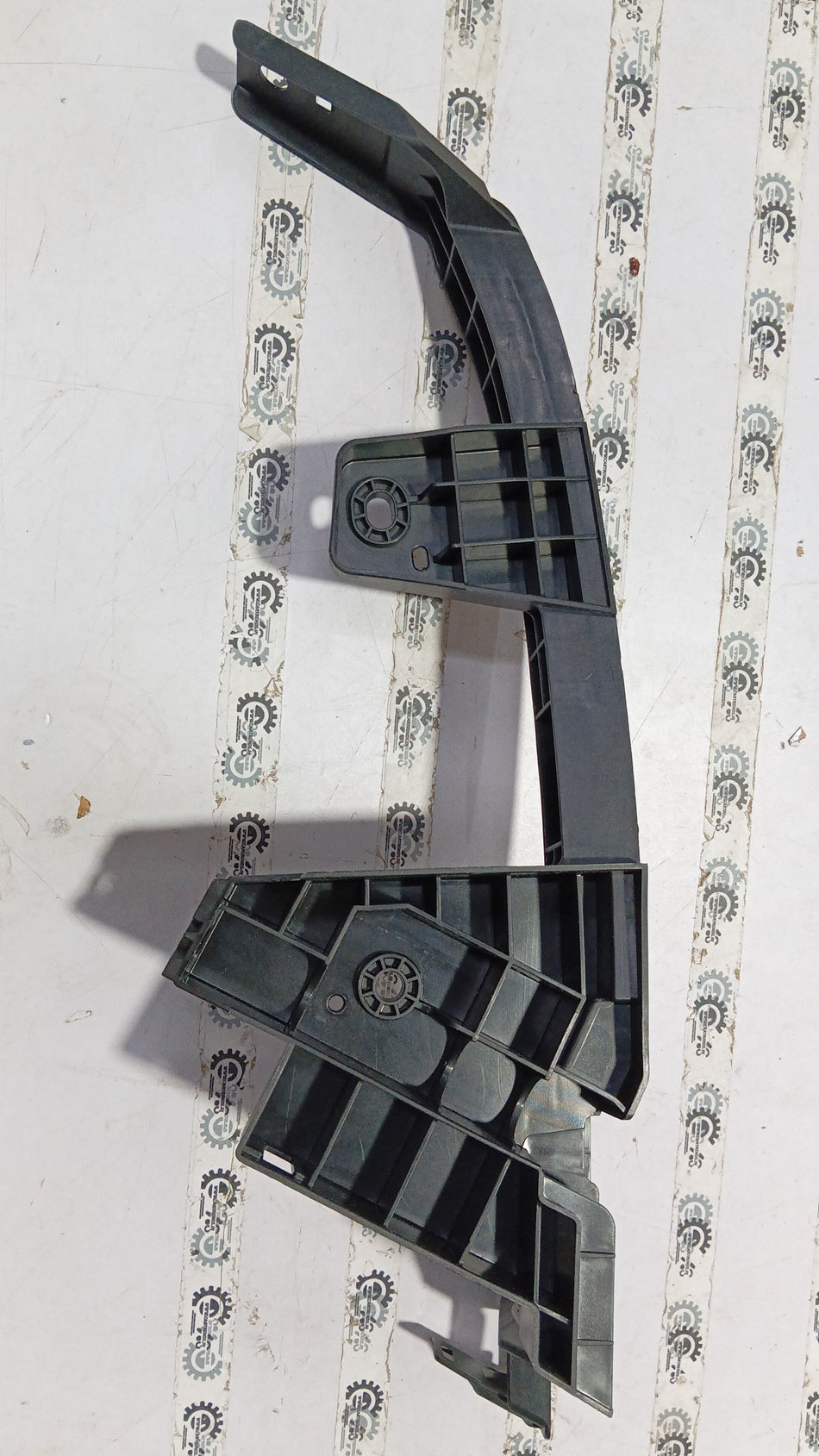 Honda City upper bumper corner replacement part, showing the black plastic corner piece with mounting points.