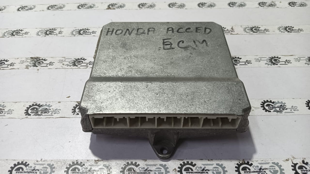 Honda Accord electronic control module part 37820RCBY81, close-up view of the vehicle component with wiring connections.