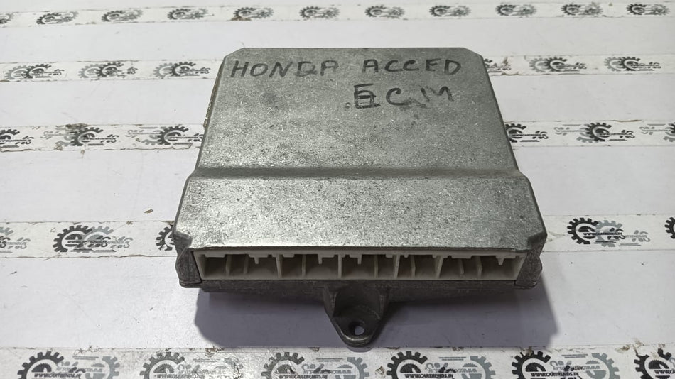 Honda Accord electronic control module part 37820RCBY81, close-up view of the vehicle component with wiring connections.