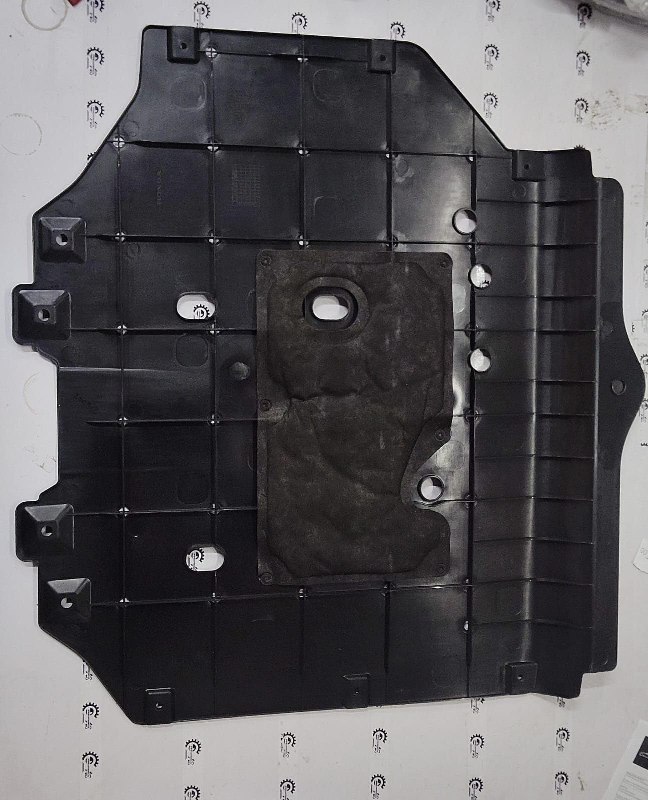 Honda City engine cover with the model number 74111T9CK20, featuring black plastic with branding details.