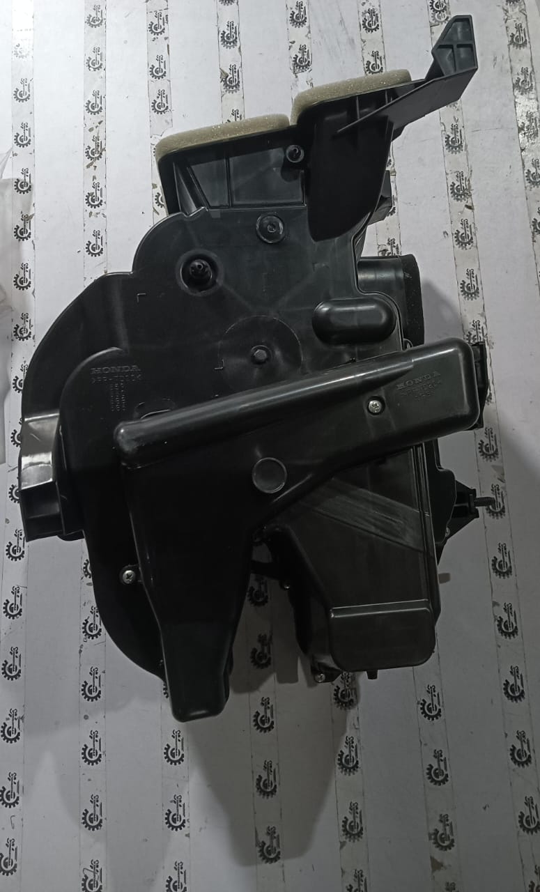 Honda heater subassembly part 79106T4VK01, showing the compact heater component with hoses and electrical connectors.