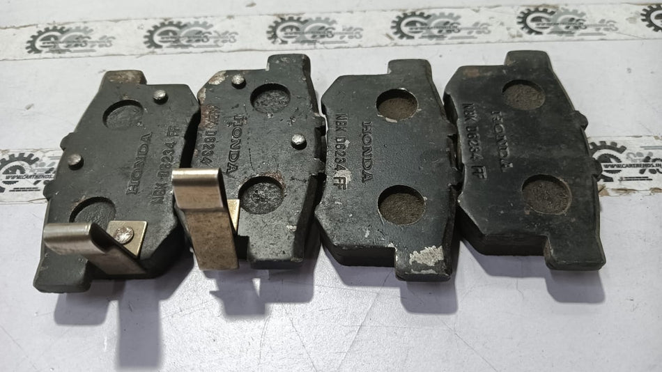 Honda Accord brake pad set from Honda, model 43022SV4G22, showing the new brake pads with mounting hardware.