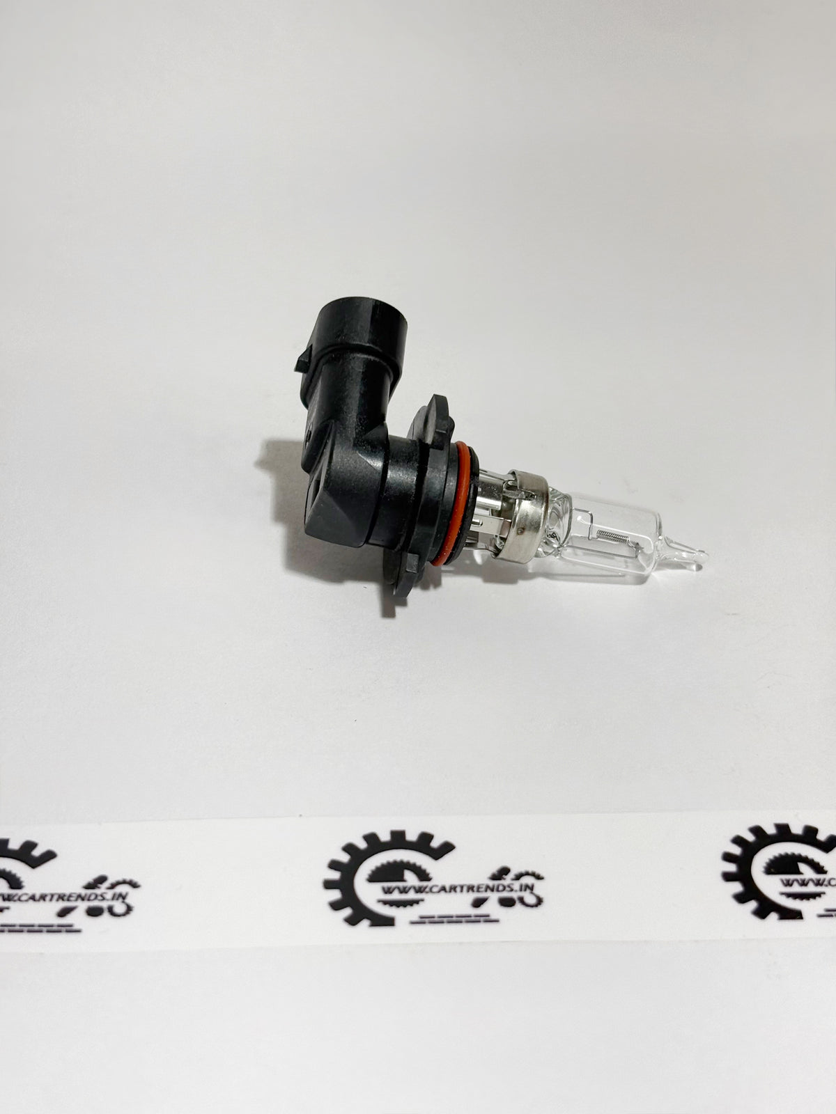 Honda HB3 12V 60W headlight bulb for Honda vehicles, showing its clear glass and metal base.