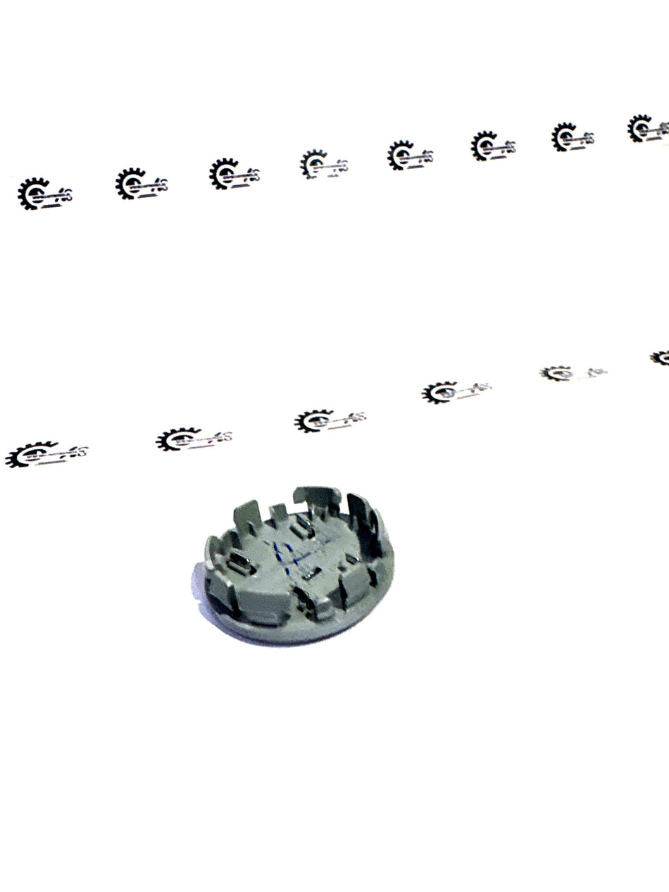 Honda wheel center cap assembly in aluminum with Honda branding, designed for vehicle wheel enhancement.