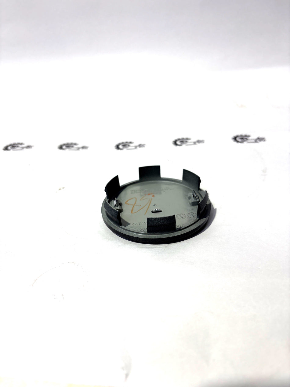 Honda wheel center cap assembly in aluminum with Honda branding, designed for Honda vehicles.
