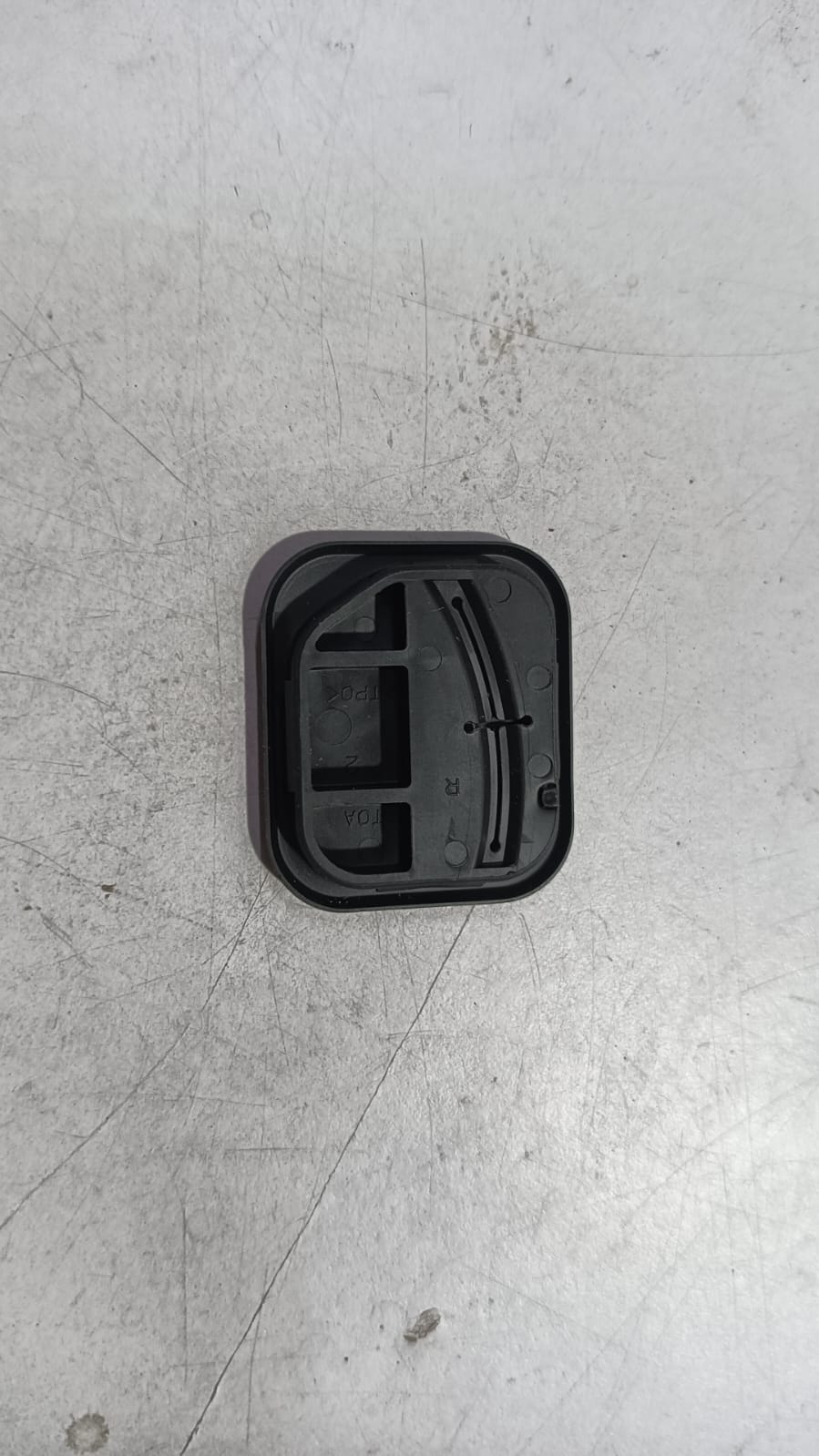 Honda Accord child lock cap, OEM part 72612T0AA01, showing close-up of the black plastic lock cover.