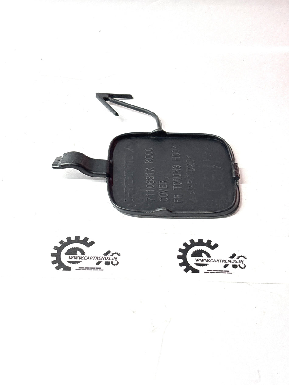 Honda COVER.FR towing hook part 7110631XK00ZC mounted on a vehicle, showcasing the durable Honda towing hook design.