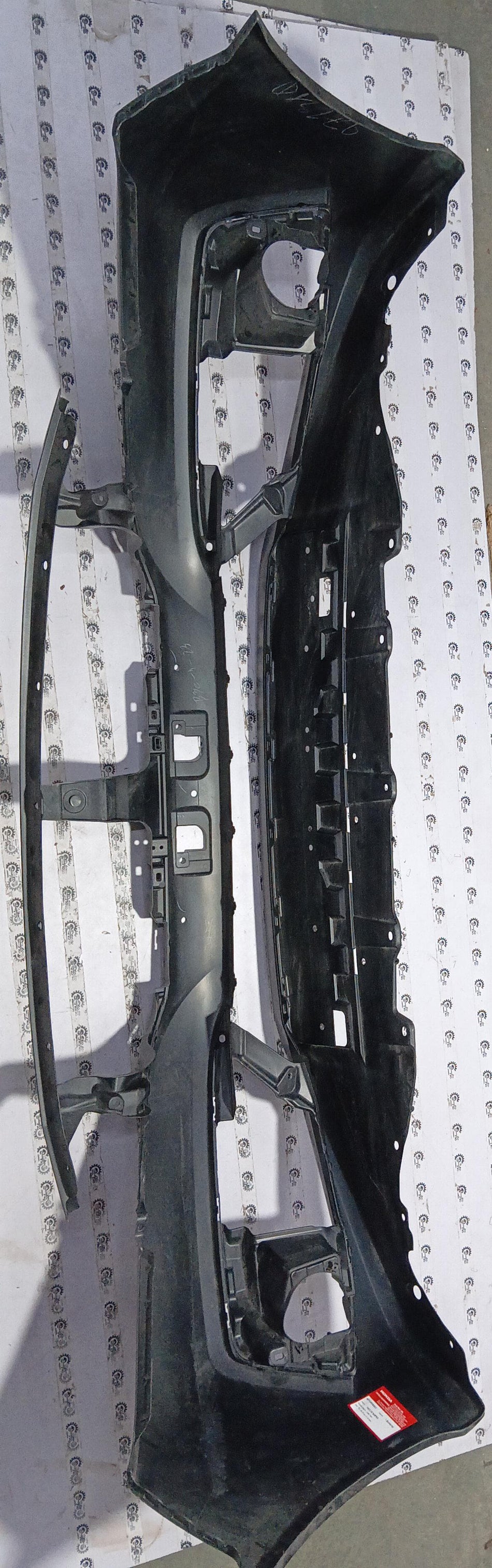 Honda Civic face bumper in black, designed for model 04711TECN50ZZ, showing front view with smooth surface and mounting points.