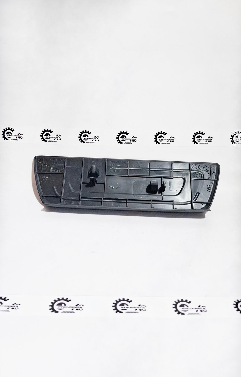 Honda Amaze garnish part with black and chrome finish, designed for stylish vehicle enhancement.