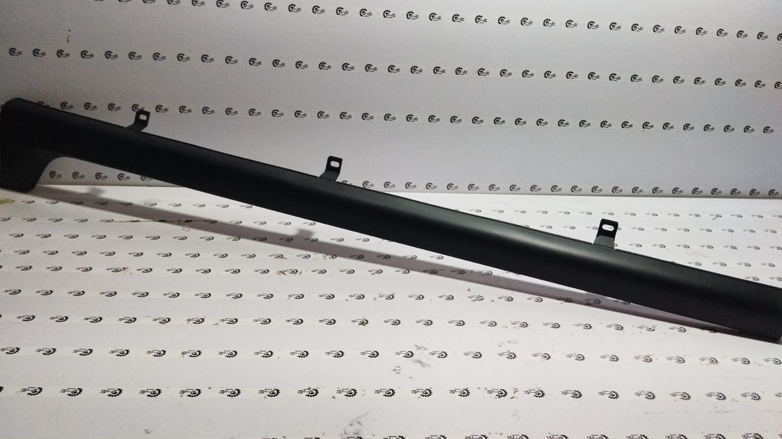 Honda WRV left running board garnish with black finish, visible mounting details and sleek design.