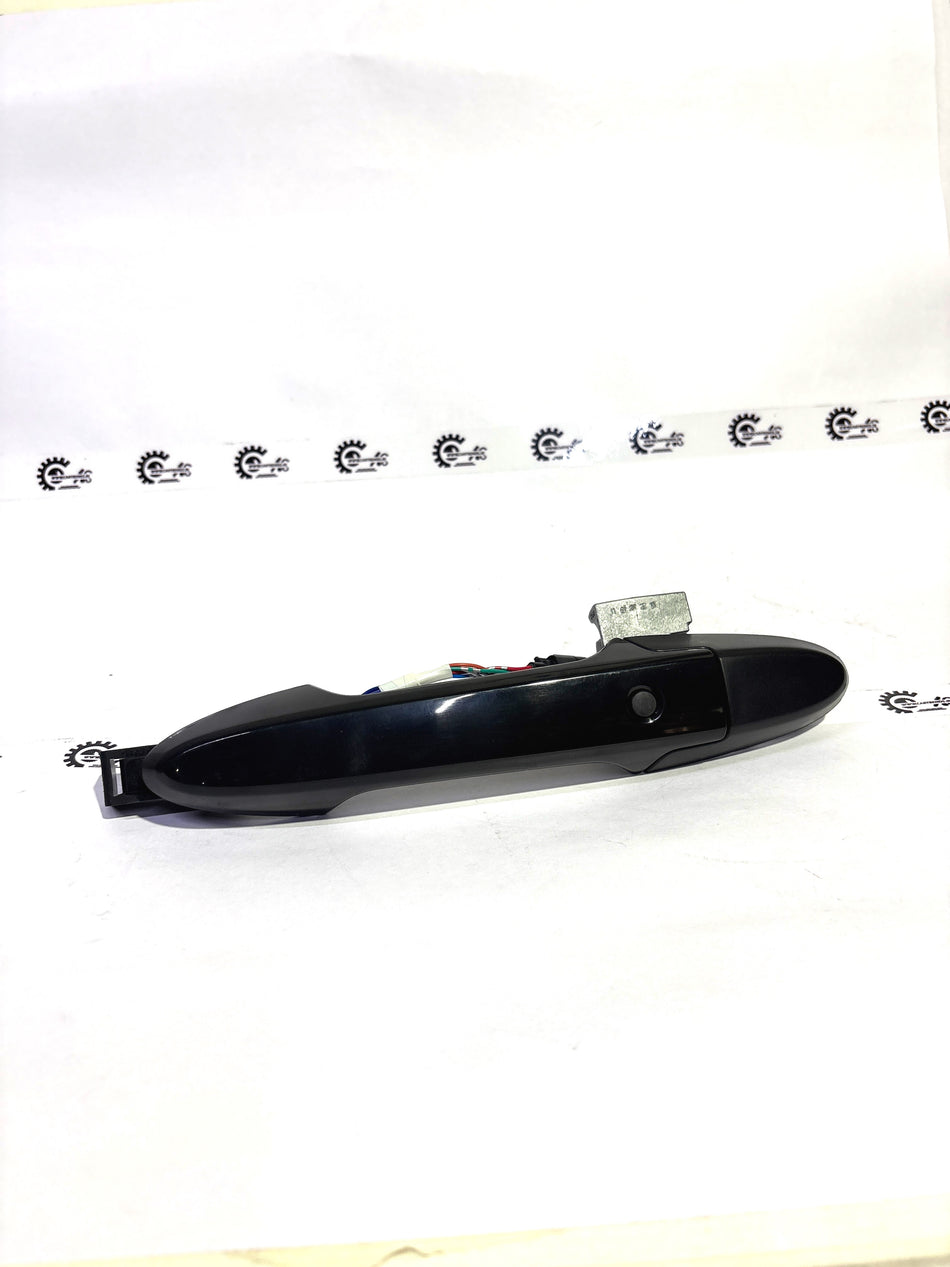 Honda handle assembly T99 model, black plastic exterior with metal mounting components, for vehicle door or trunk use.