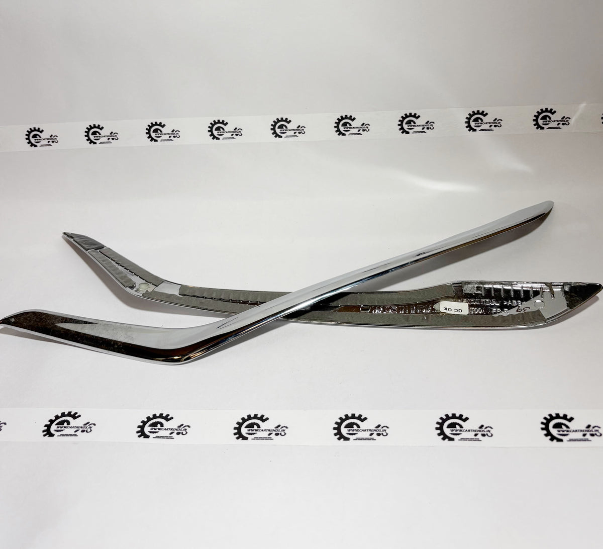 Honda front bumper side garnish kit, part number 08F23T00700A, showing the sleek side trim piece for Honda vehicles.
