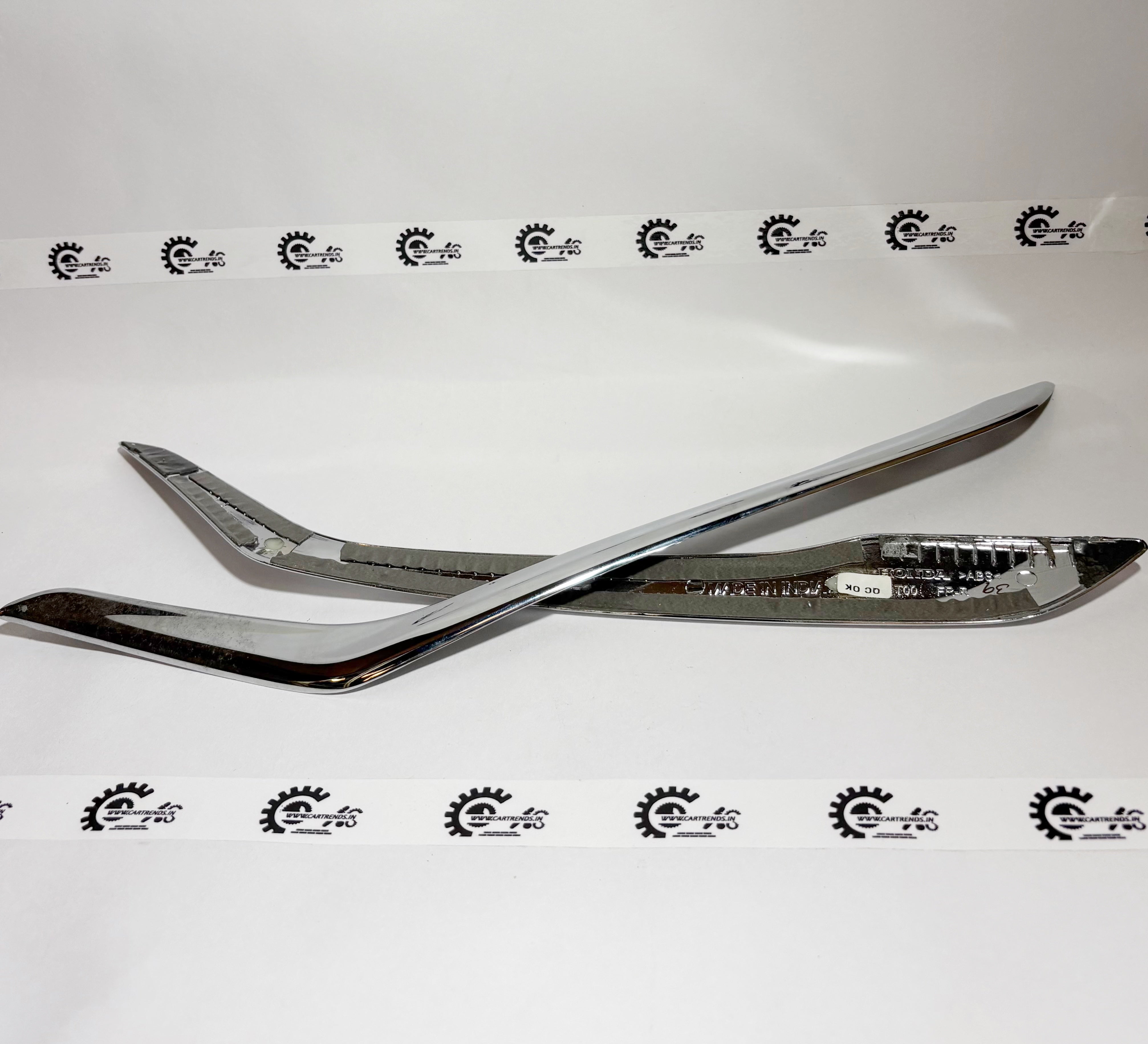 Honda front bumper side garnish kit, part number 08F23T00700A, showing the sleek side trim piece for Honda vehicles.