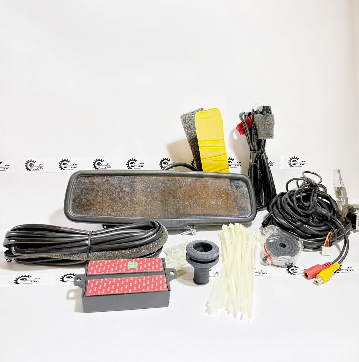 Honda kit with rear sensor, IRVM, and camera, featuring black components and wiring, designed for vehicle safety and parking assistance.