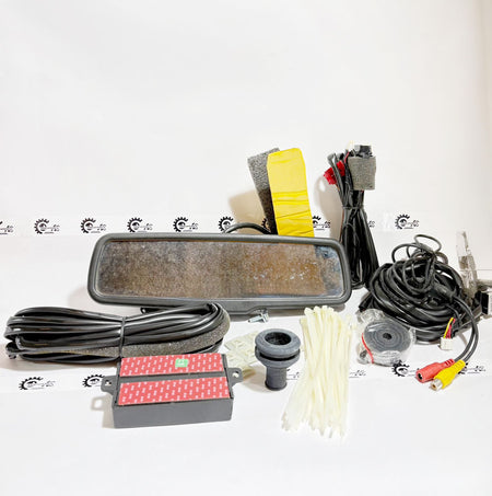 Honda kit with rear sensor, IRVM, and camera, featuring black components and wiring, designed for vehicle safety and parking assistance.