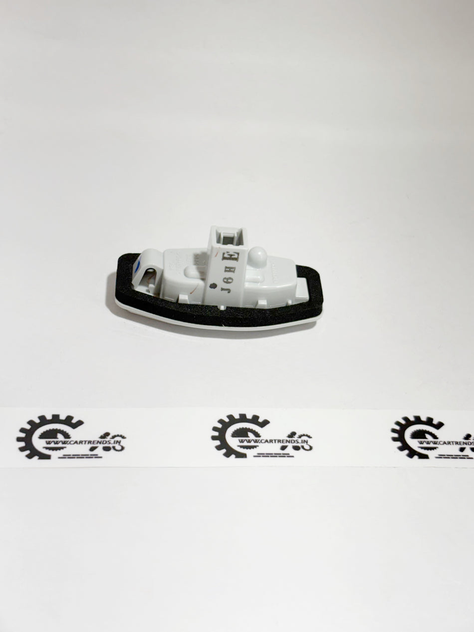 Honda license light assembly part 34100T9A003, showing the vehicle license plate illumination light in a close-up view.