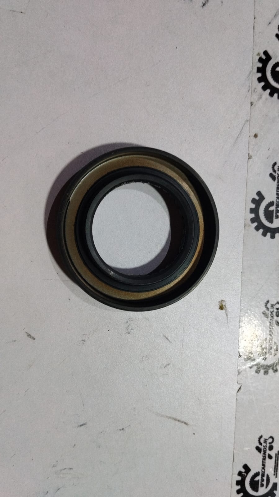 Honda oil seal 35x58x8, model 91206R0Z003, showing the black rubber seal with metal casing for engine protection.