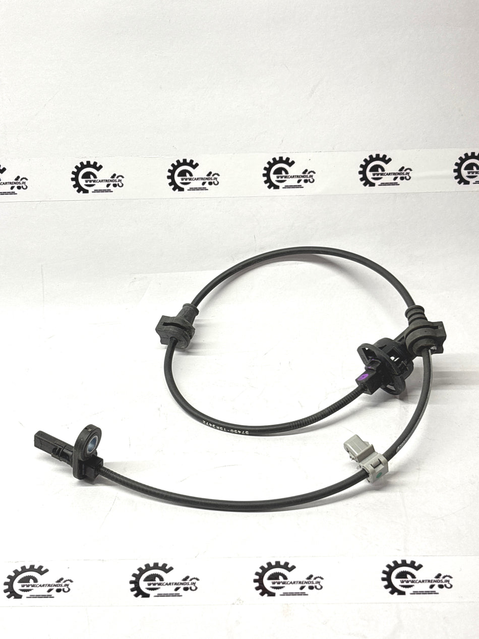 Honda front sensor assembly part 57450TG2D01, automotive sensor for vehicle safety and collision detection.
