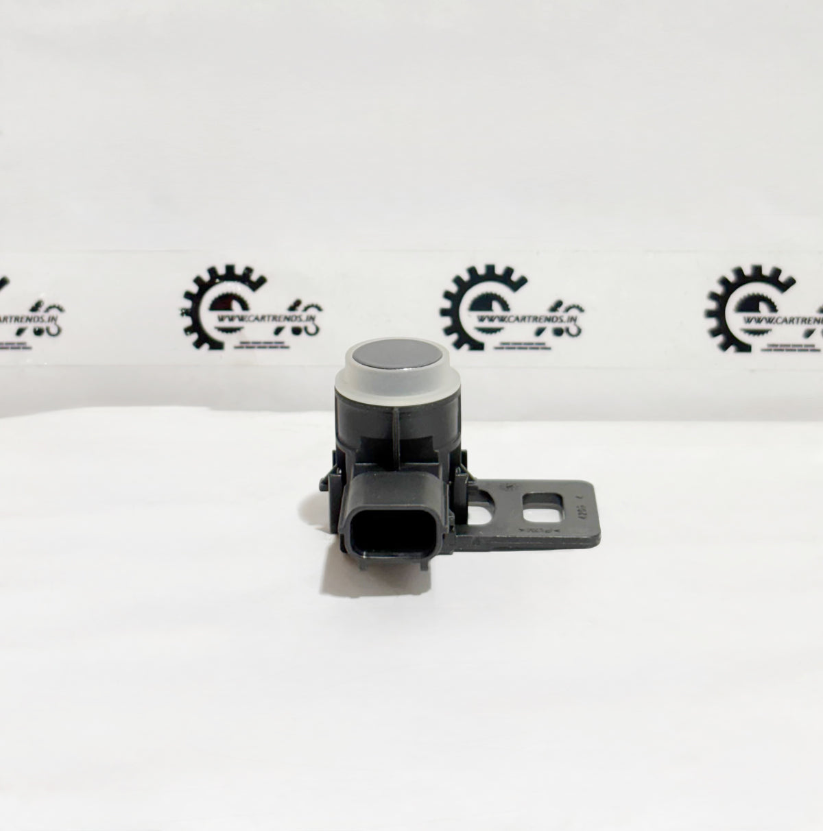 Honda parking sensor assembly with clip, model 39680T00D21ZF, shown installed in a vehicle's bumper.