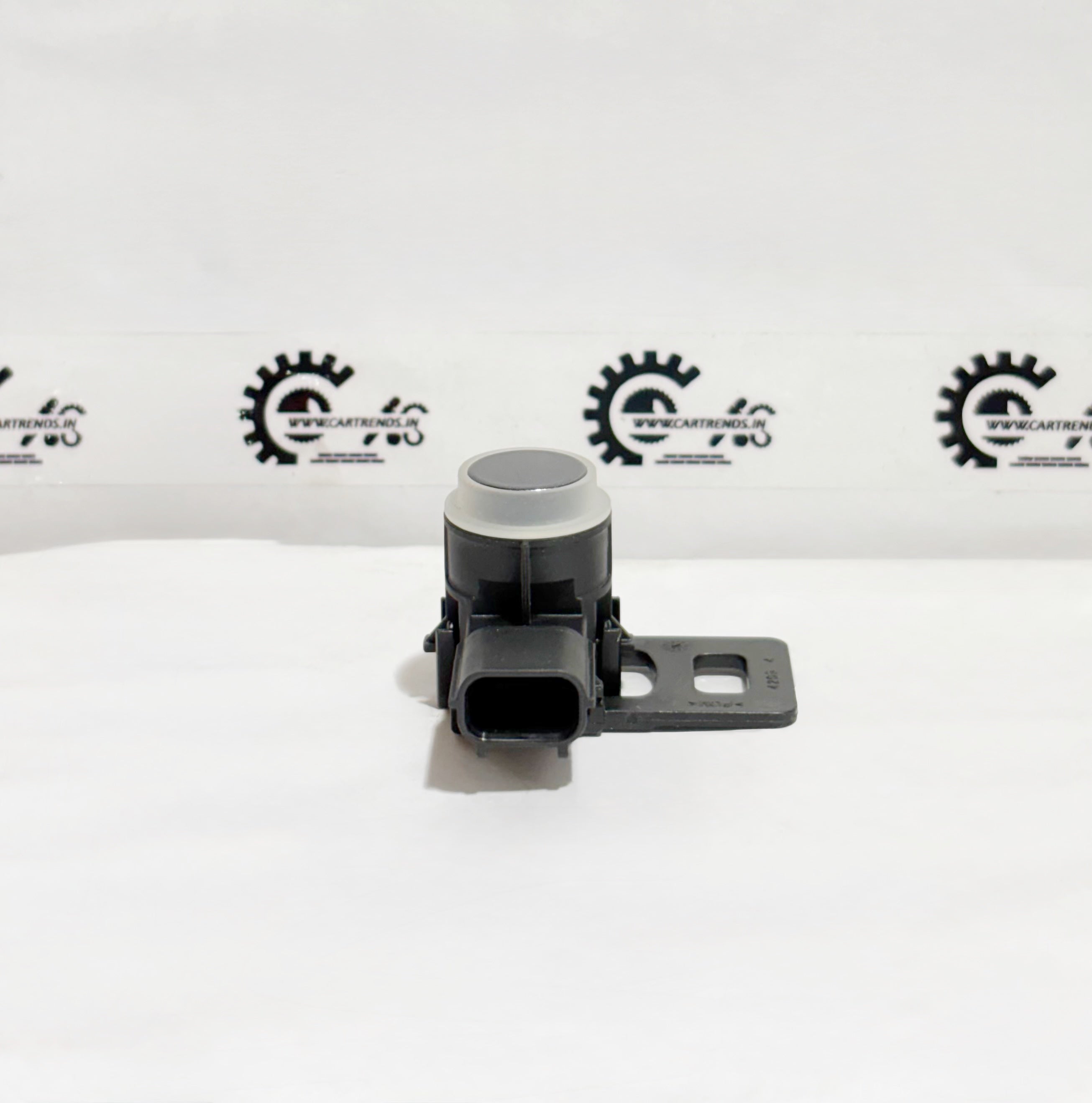 Honda parking sensor assembly with clip, model 39680T00D21ZF, shown installed in a vehicle's bumper.