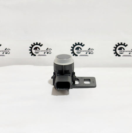 Honda parking sensor assembly with clip, model 39680T00D21ZF, shown installed in a vehicle's bumper.