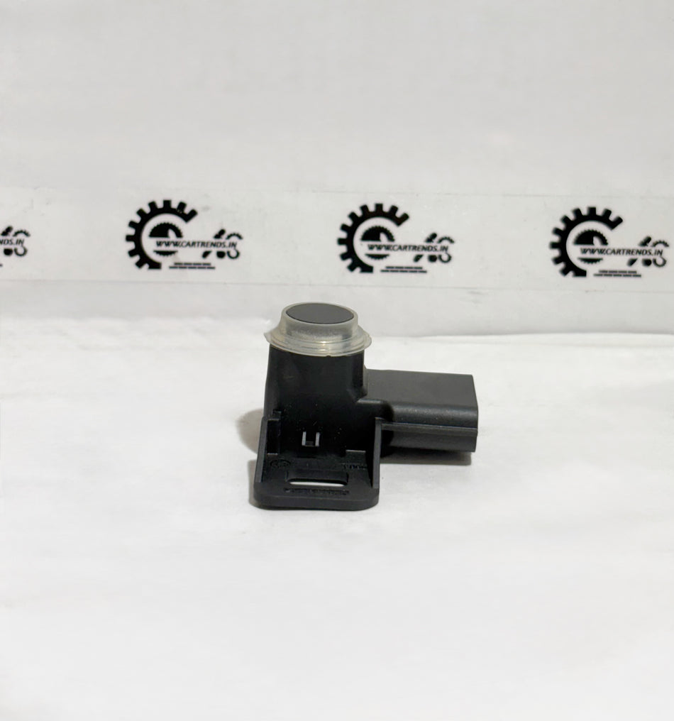 Honda parking sensor assembly with clip, model 39680TSVW11ZH, showing the sensor unit with attached clip for vehicle parking assistance.