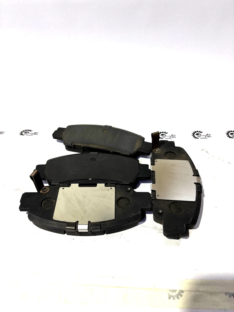 Honda front brake pad set for 17CL-15VN 23T.NF12 model, showing the new brake pads ready for installation.