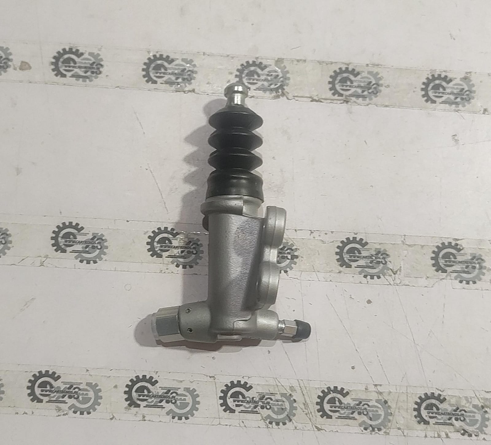 Honda slave cylinder assembly 46930SNAA41, automotive brake component with visible metal cylinder and hydraulic fittings.
