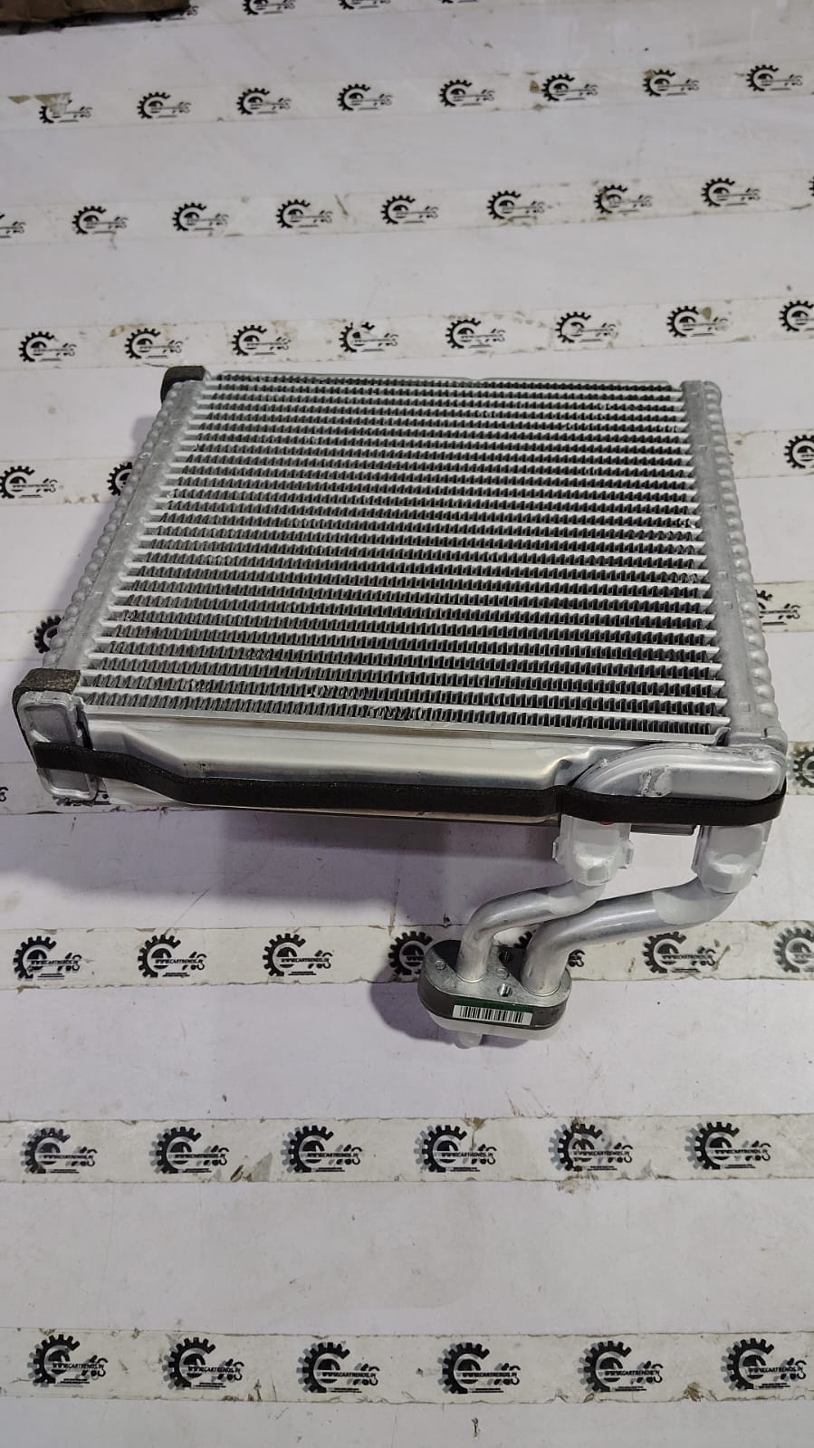 Hyundai cooling coil evaporator for Hyundai Santro Xing, showcasing the metal coil component used in vehicle air conditioning systems.