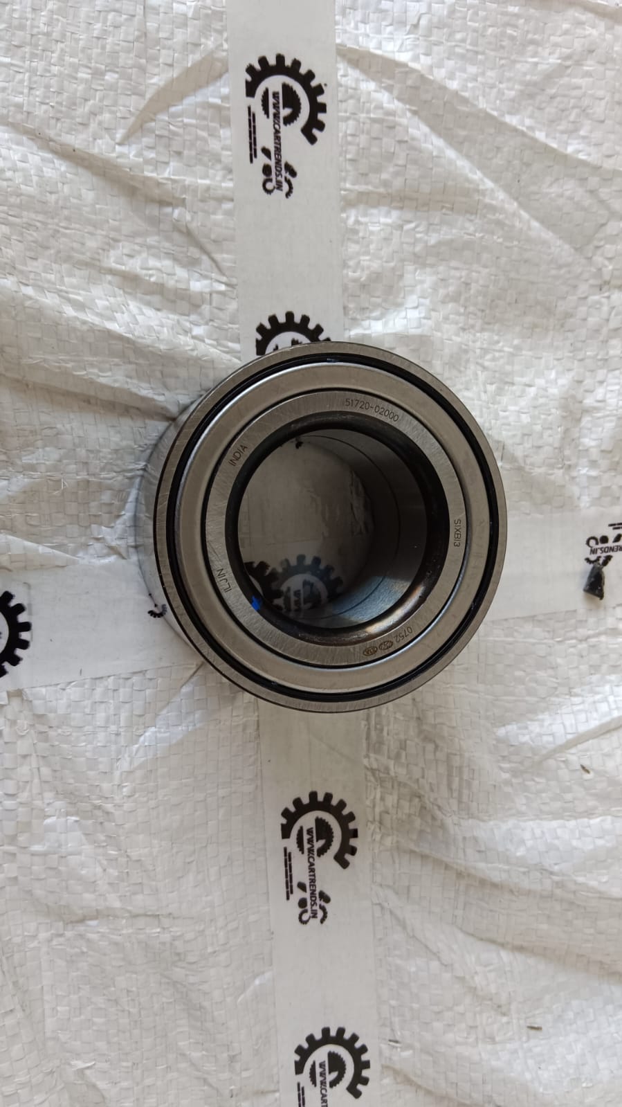 Hyundai Santro Xing front wheel bearing, automotive part, with visible metal bearing and mounting components.