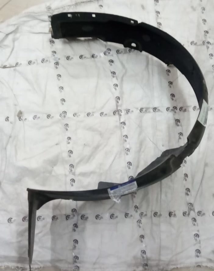 Hyundai Verna Fluidic right side fender lining, part number 868121V000, shown in black plastic on vehicle.