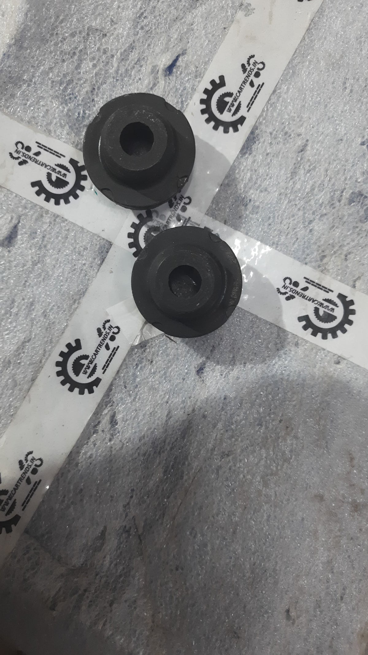 Hyundai Aura and i20 lower radiator insulator, part number 253361J000, shown in black with mounting tabs