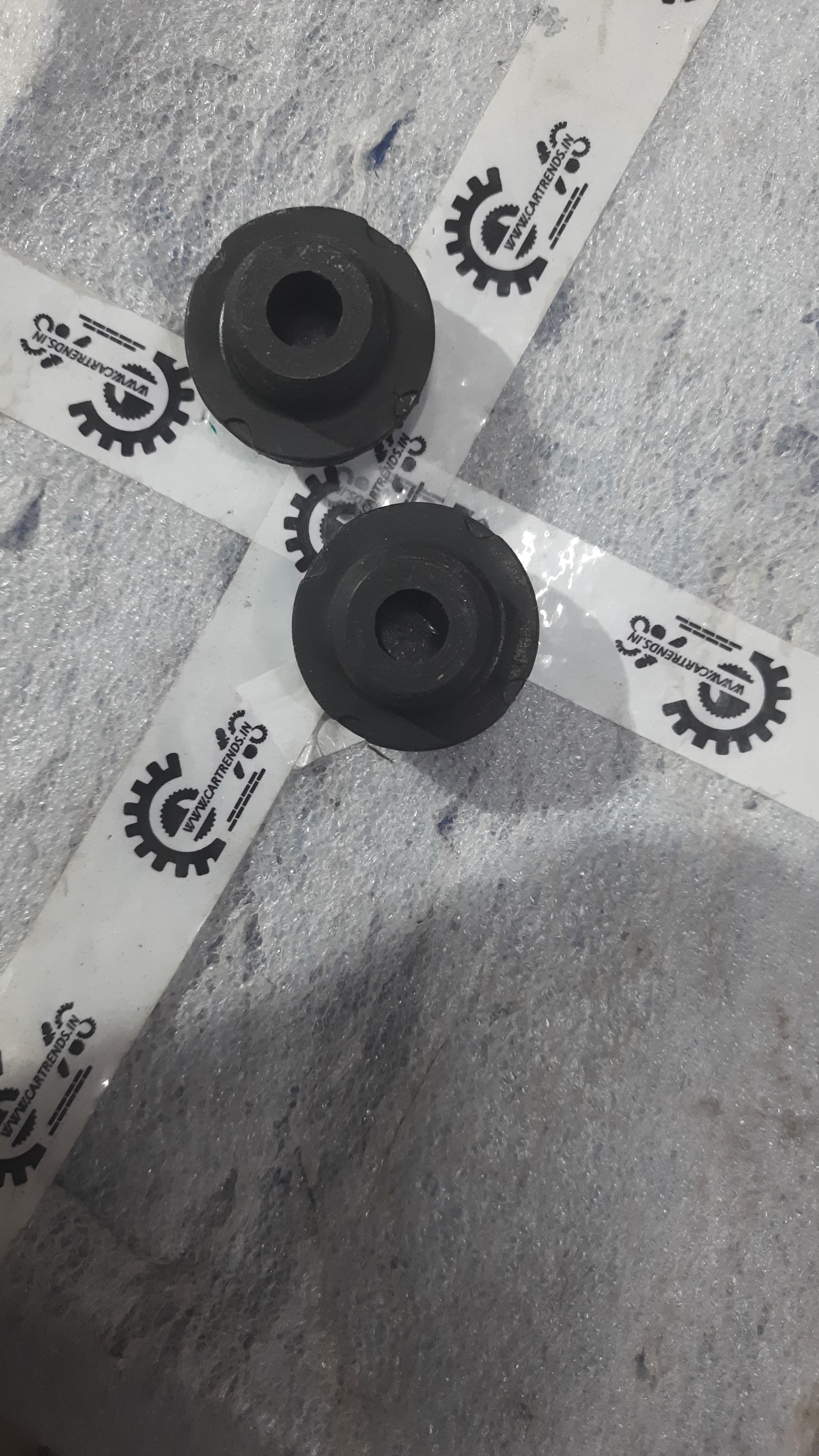 Hyundai Aura and i20 lower radiator insulator, part number 253361J000, shown in black with mounting tabs