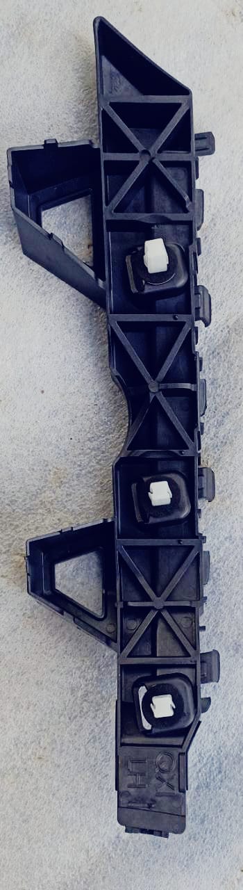 Hyundai Venue rear left bumper bracket labeled #86651K3000, showing the black metal car part for vehicle repair.