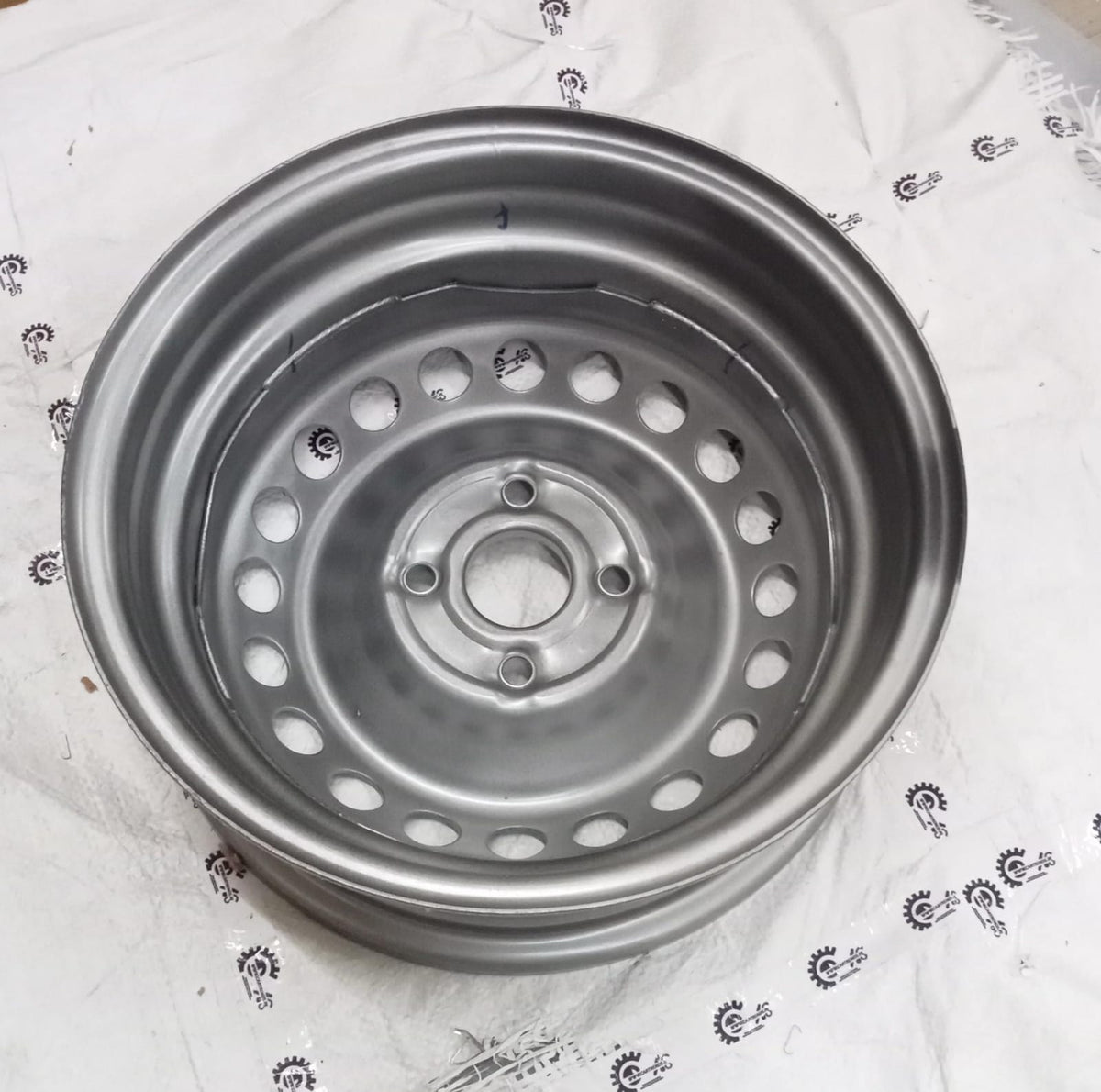Hyundai steel wheel assembly with black finish for Hyundai vehicle, showing the full wheel with tire mounted.
