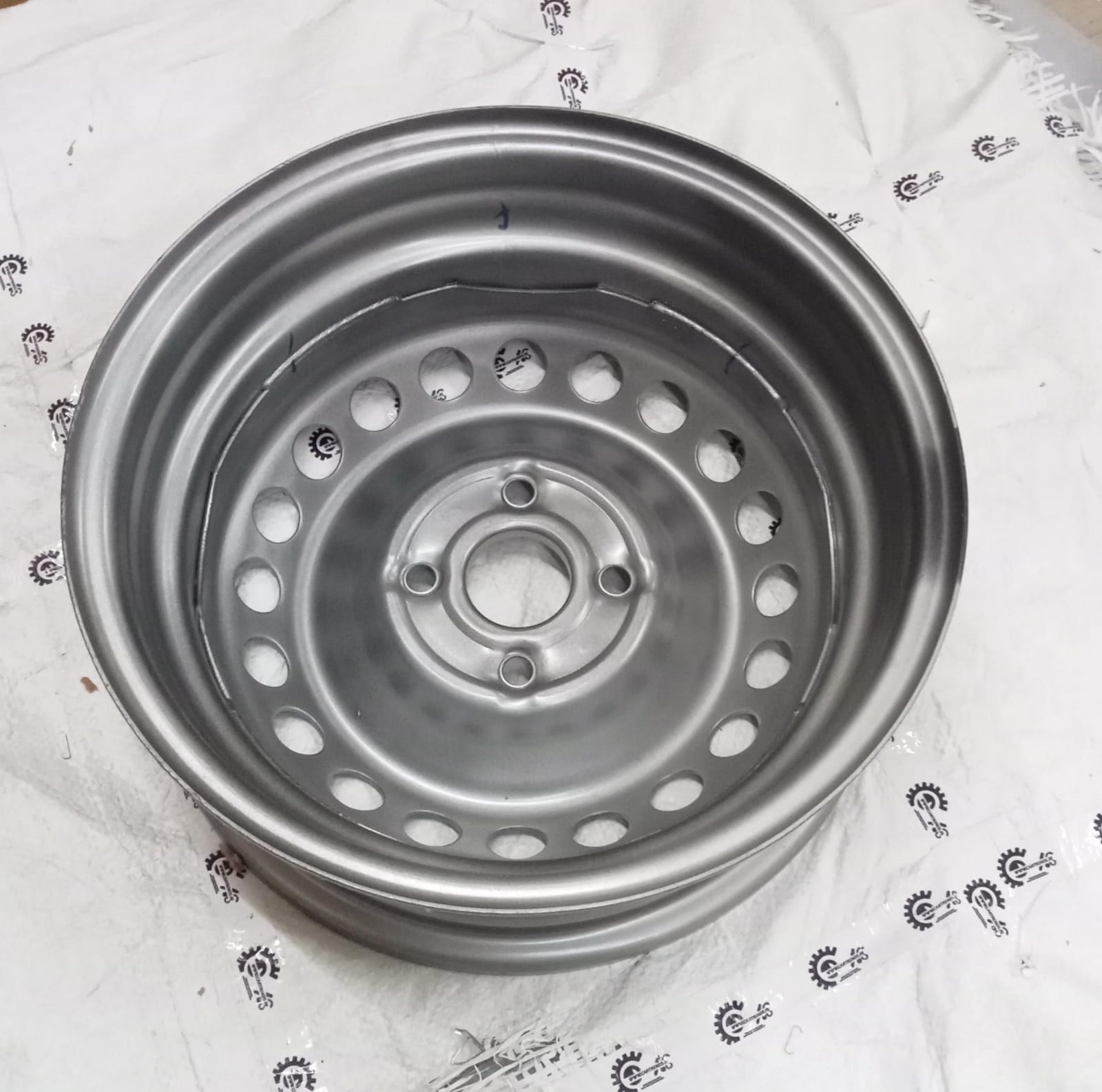 Hyundai steel wheel assembly with black finish for Hyundai vehicle, showing the full wheel with tire mounted.