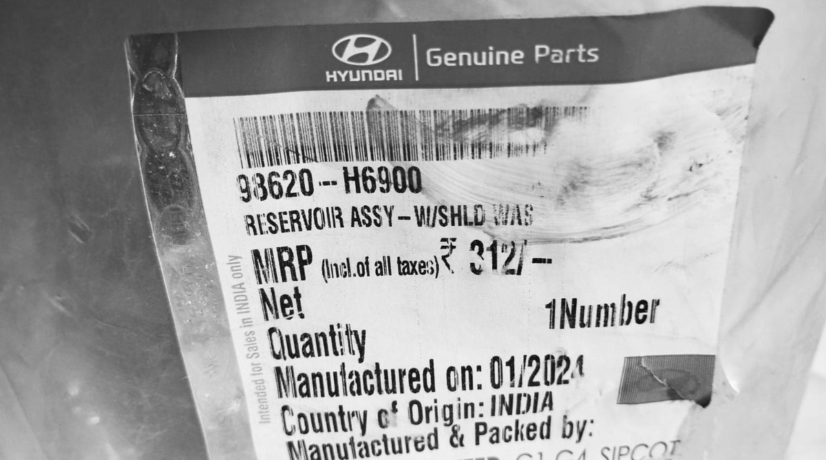 Hyundai Verna Next Gen wiper bottle with Hyundai branding, clear view of the windshield washer fluid reservoir in the engine bay.
