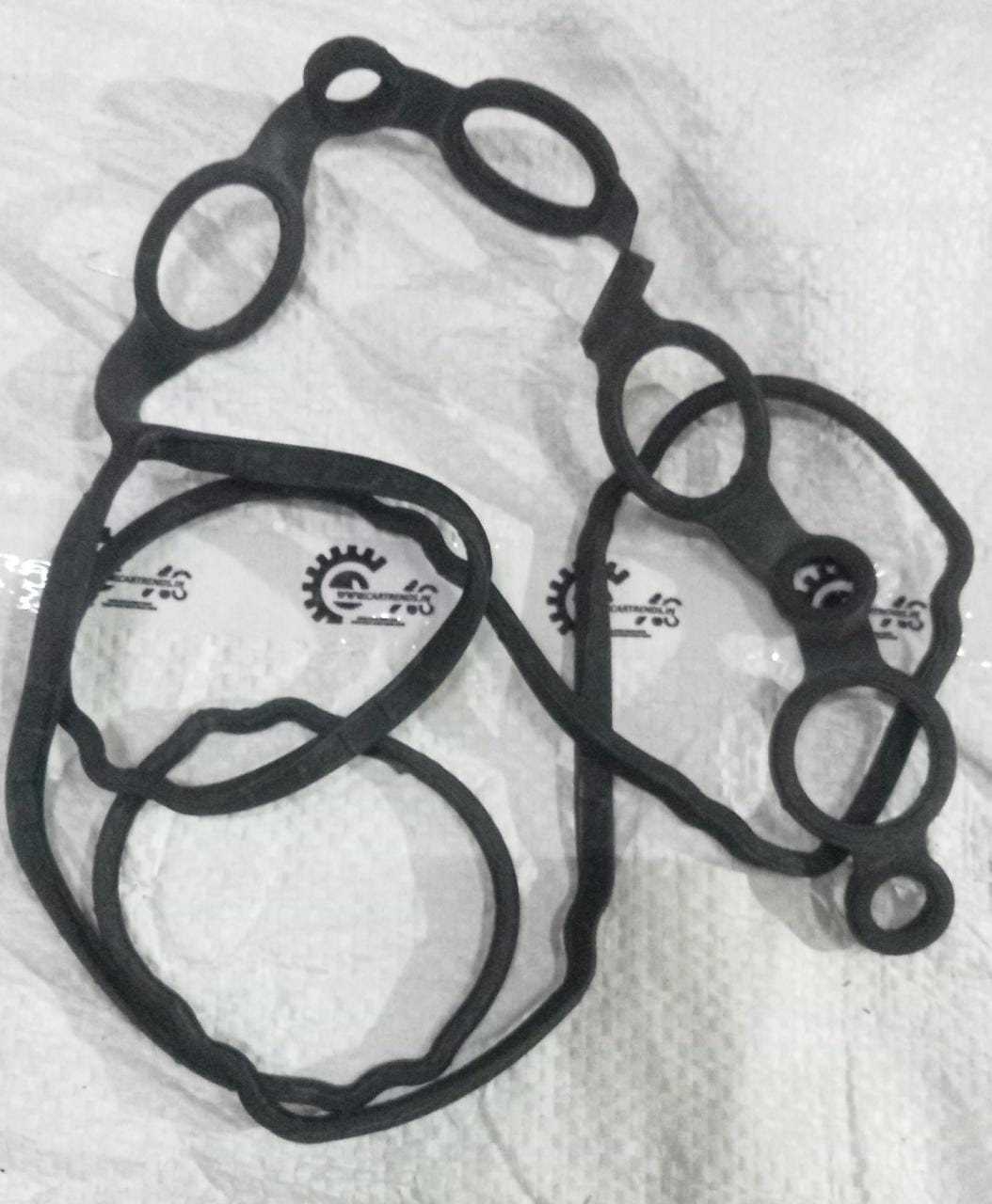 Hyundai Tapid Cover Packing for Xcent, spare automotive part, shown in black with branding details visible.