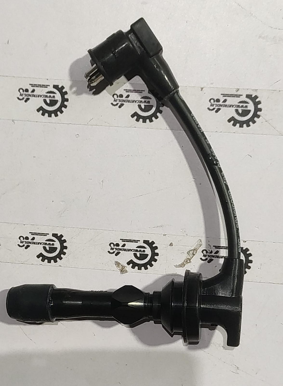 Hyundai I10/Xcent plug wire spare part, showing the black wire with connectors for engine ignition system.
