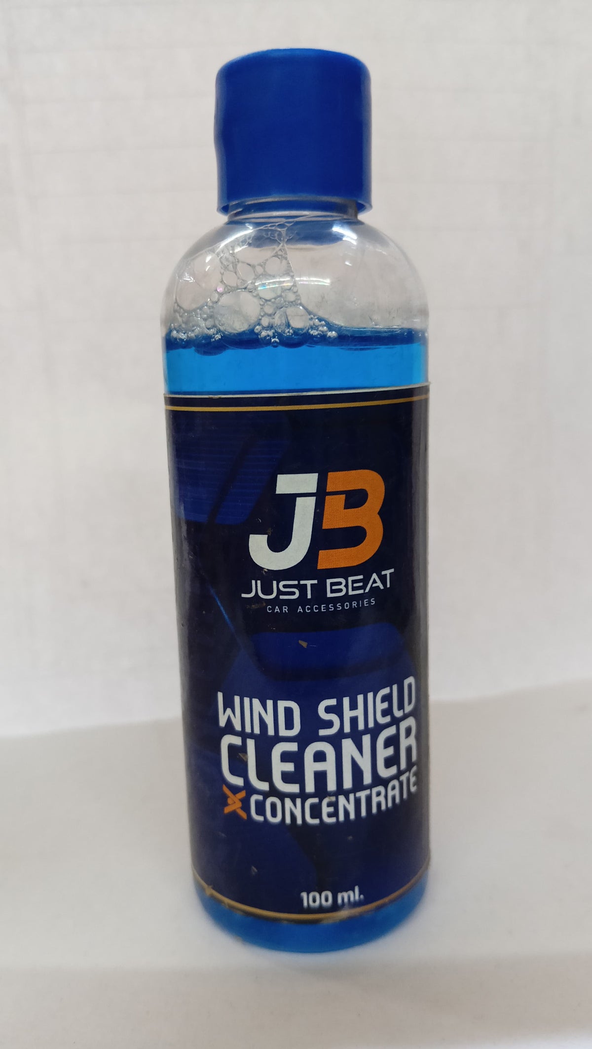 JB Wind Shield Cleaner 100ml spare part for windshield cleaning, shown in the image with bottle and spray nozzle.